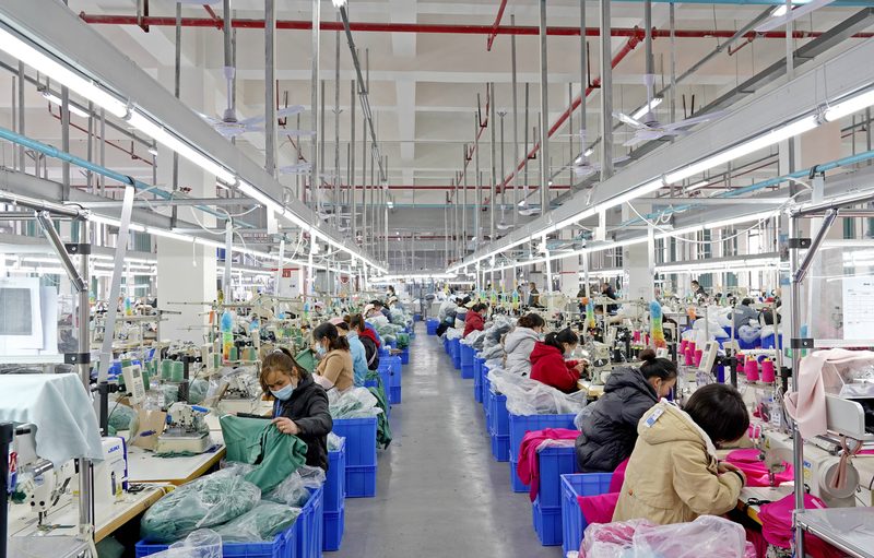 Silk pajama factory sewing workshop in full production